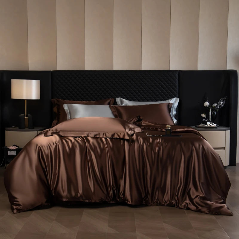 Bedroom with a large bed covered in brown bedding, nightstands with lamps, and striped wallpaper.