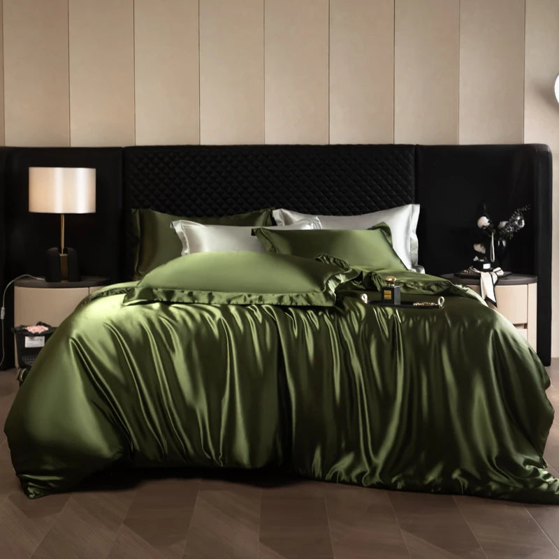Bed with green satin bedding in a bedroom setting.