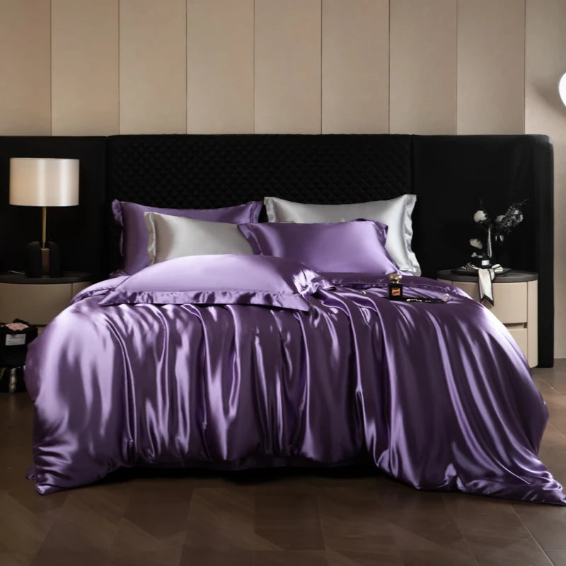 Purple satin bedding set on a bed with a striped wall background